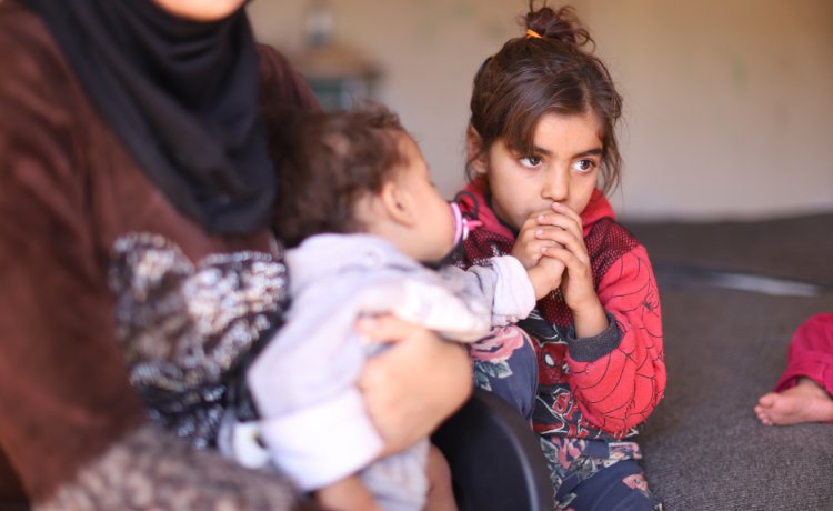 Soumaia and her children received support, including medicines, clothes and counselling, from the UNFPA-supported Syrian Family Planning Association. © UNFPA Syria/Alaa Ghorra