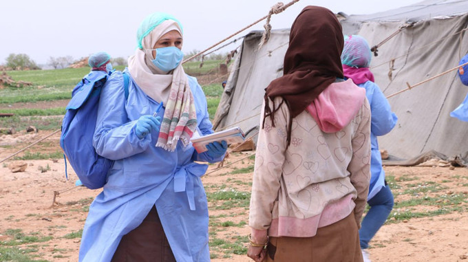   عمال التوعية في سوريا وهم يعملون على رفع مستوى الوعي حول الوباء. © صندوق الأمم المتحدة للسكان سوريا