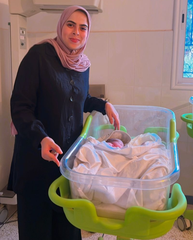 Midwife Maria with one of the newborns she helped to deliver amid the chaos of the earthquake. © UNFPA Morocco