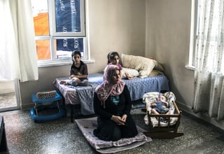 Fatma Fayiz Dawi (centre) regularly visits a UNFPA-supported Safe Space, where she can receive psychosocial support and other services.