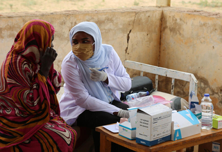 Two midwives at a UNFPA-supported clinic before conflict gripped the country and all but obliterated its health service. © UNFPA