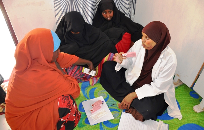 A midwife talks to girls about birth spacing at a youth firendly centre supported by UNFPA