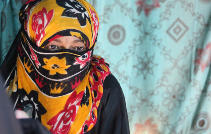 A survivor of gender-based violence was photographed at a displacement camp in 2011 
