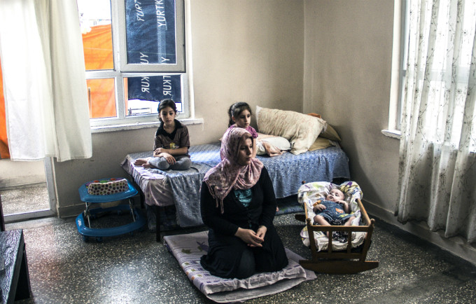 Fatma Fayiz Dawi (centre) regularly visits a UNFPA-supported Safe Space, where she can receive psychosocial support and other services.