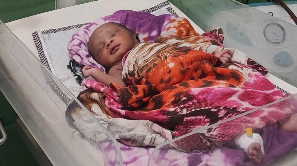 A newborn in Al-Saudi Maternity Hospital after large portions of the hospital were demolished in artillery fire. © Al-Saudi Maternity Hospital