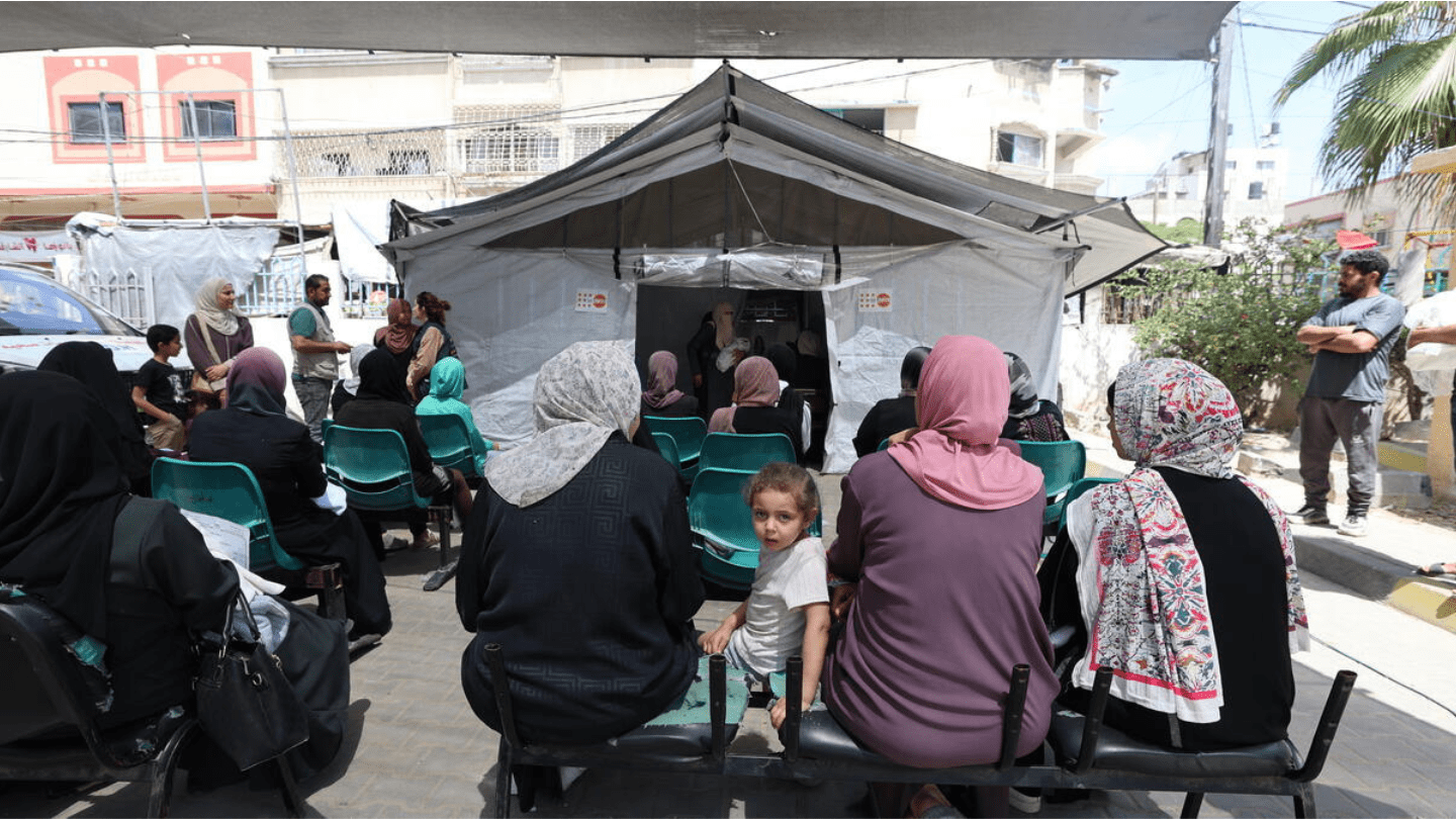Women and girls wait for services at a UNFPA-supported mobile clinic.