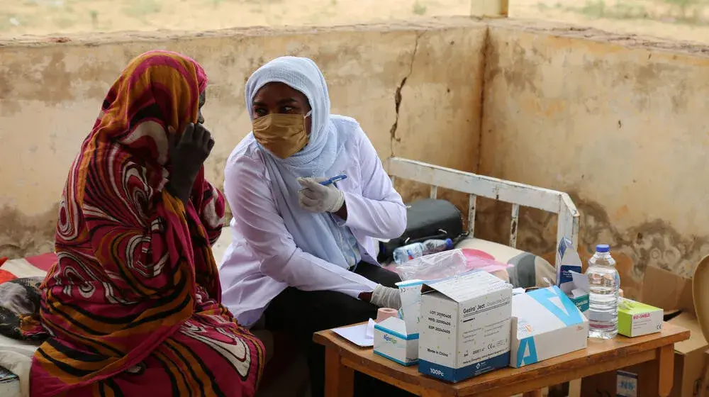 Two midwives at a UNFPA-supported clinic before conflict gripped the country and all but obliterated its health service. © UNFPA